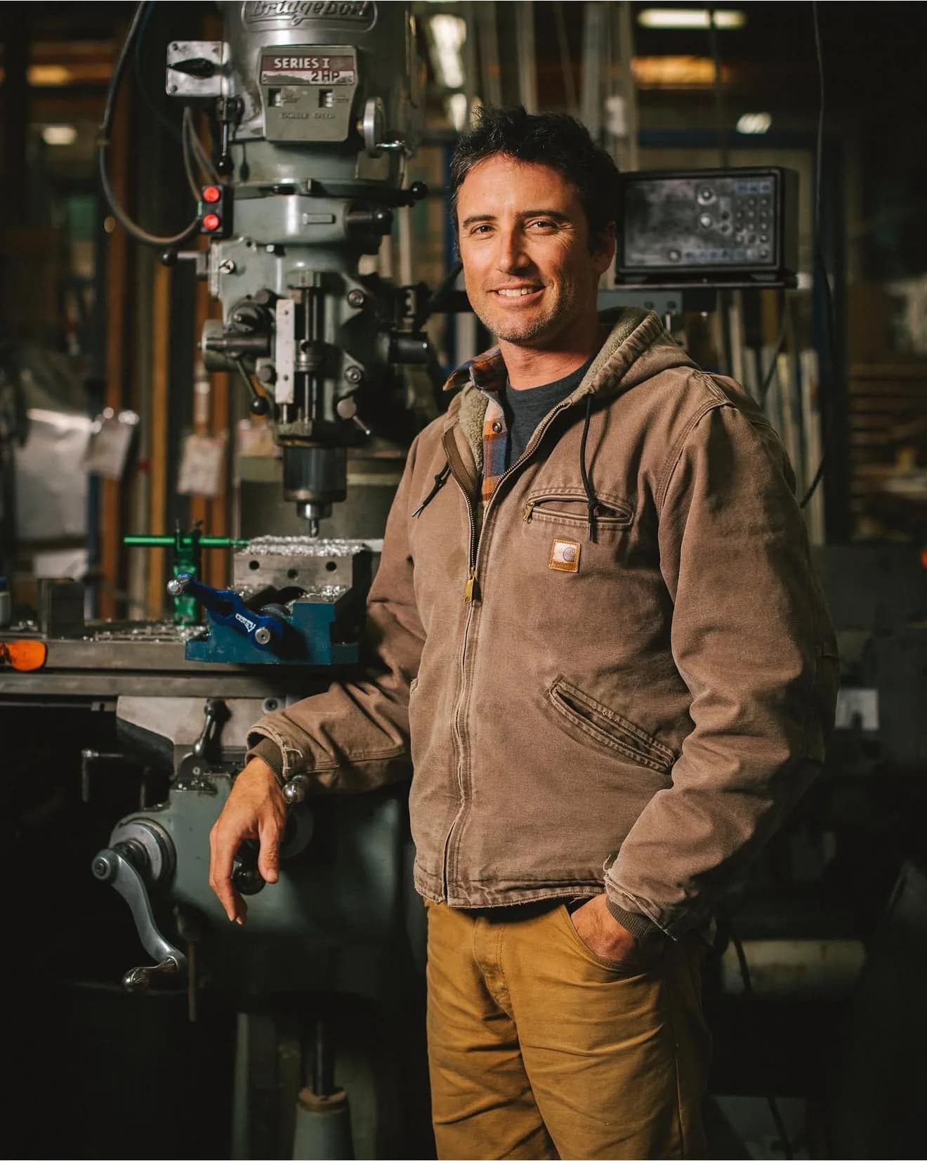 Environmental portrait of a machinist in his workshop