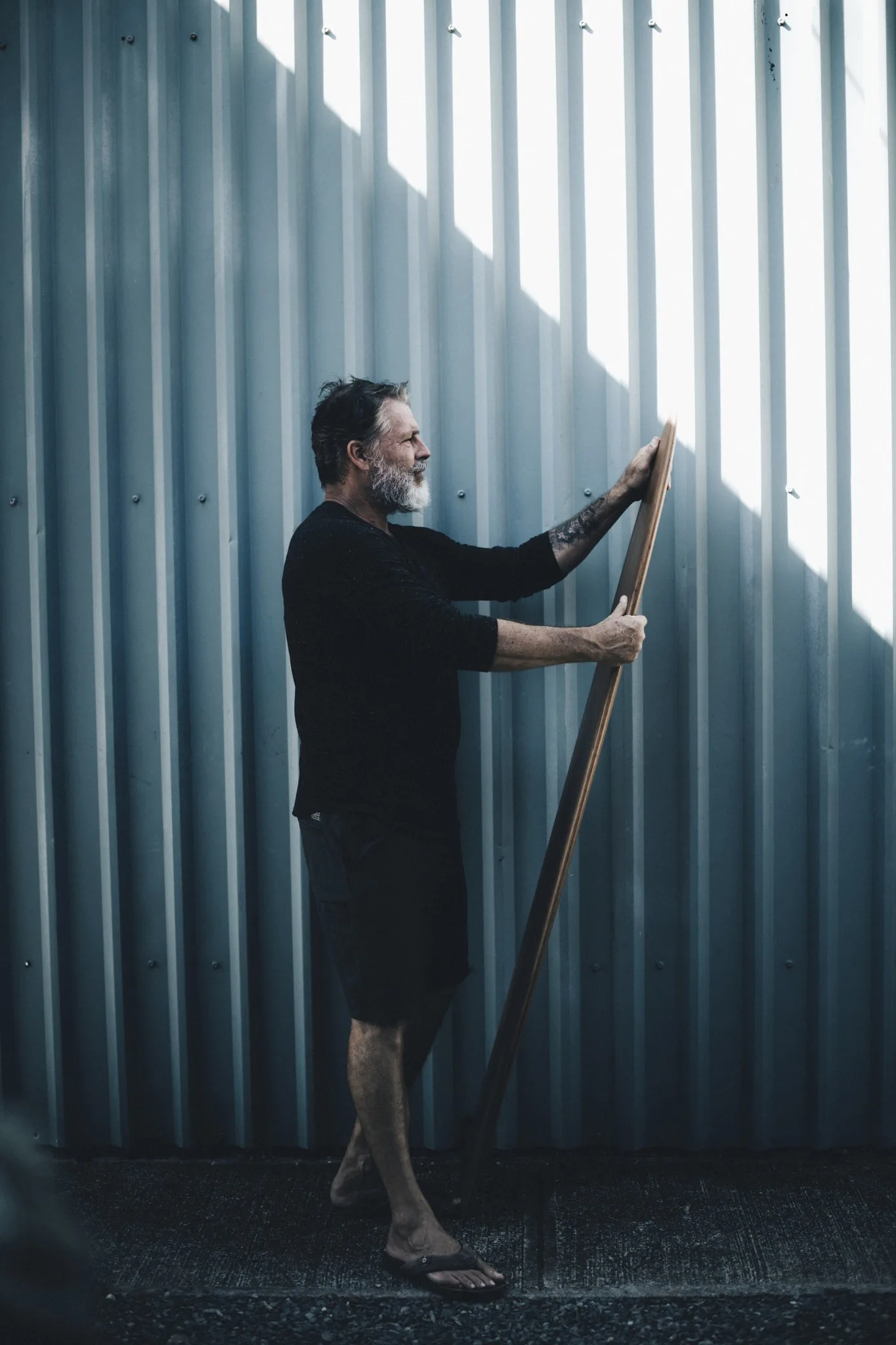 Editorial portrait against corrugated steel
