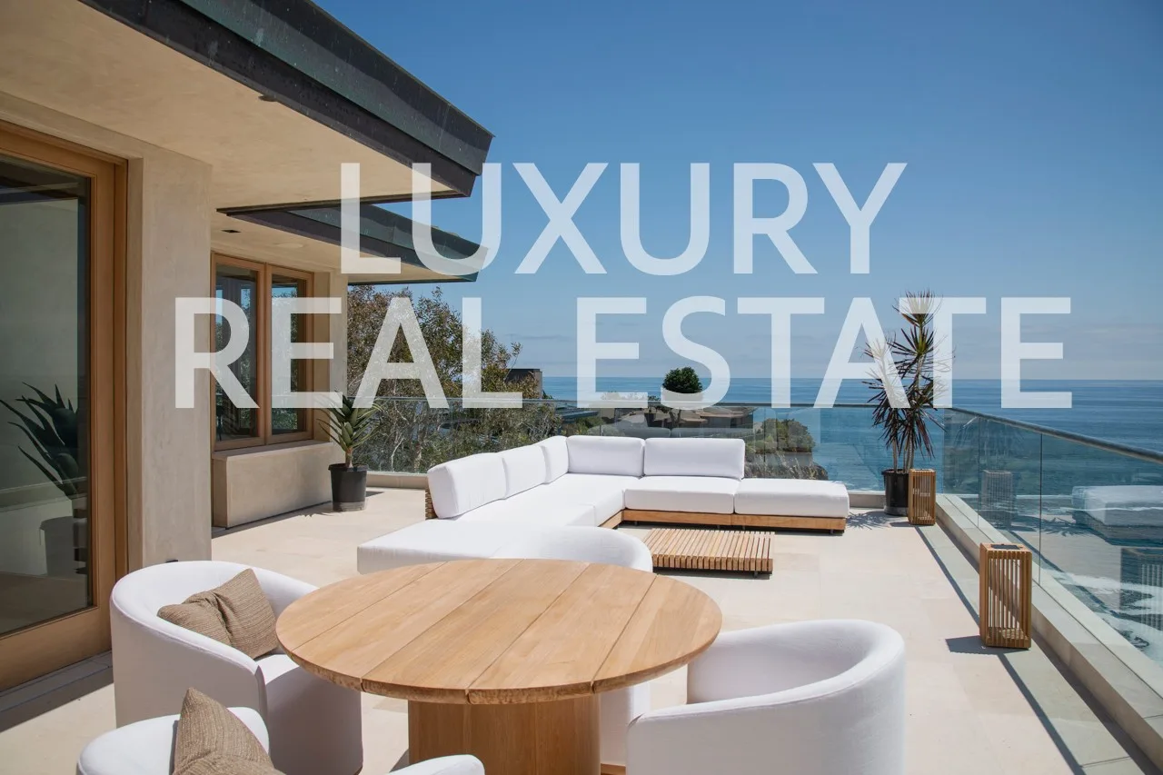 Ocean-view terrace of a luxury listing at dusk