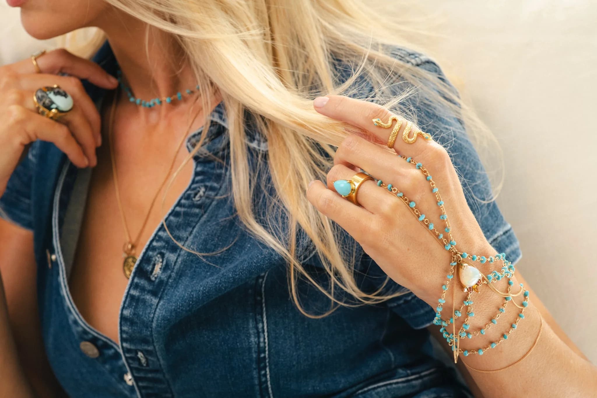 Turquoise jewelry detail on denim